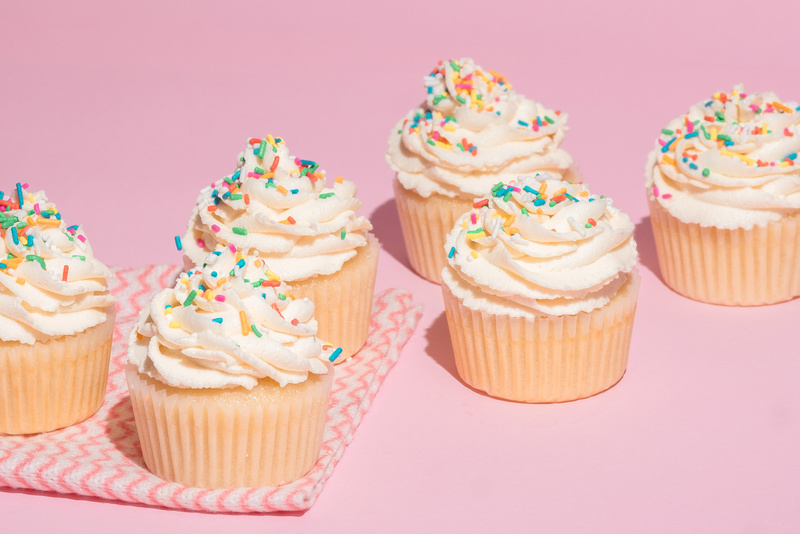 Cupcakes with Frosting and Sprinkles on a Table